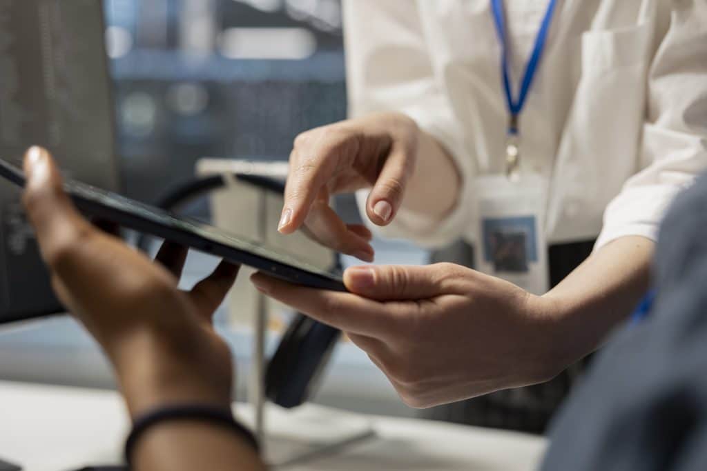 data center engineering team analyzing software logs metrics tablet close up 1024x683 2 2